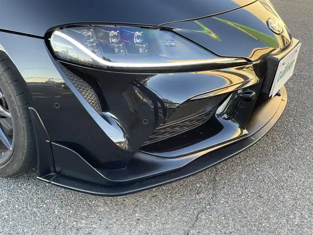 トヨタ スープラ RZ 広島県 2023(令5)年 0.8万km ブラックメタリック ワンオーナー/フルエアロ/レッドキャリパー/純正ナビ（AM/FM/フルセグTV/Bluetooth）/バックカメラ/ETC/ドライブレコーダー/JBLプレミアムサウンド/ハーフレザーシート（ブラック×レッド）/・パワーシート（メモリー機能付き）/・シートヒーター/Toyota Supra Safety/・衝突被害軽減ブレーキ/・車線逸脱警報（操舵支援付き）/・ブラインドスポットモニター/レーダークルーズコントロール/コーナーセンサー/スペアキー