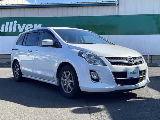 マツダ ＭＰＶ 23S 福島県 2012(平24)年 10.5万km クリスタルホワイトパールマイカ 社外メモリナビ＆フルセグＴＶ/（ＤＶＤ＆ＢＴ＆ＦＭ＆ＡＭ）/バックカメラ/衝突軽減ブレーキ/ＥＴＣ/社外１７inアルミホイール/オートライト/ＬＥＤライト/フォグランプ/電動格納ミラー/スマートキー/Ｗエアバッグ/横滑り防止装置/ＡＢＳ/純正ドアバイザー/純正フロアマット/新車保証書/取扱説明書/記録簿/純正ＡＷラジアルタイヤ４本積載/　（２１年製造、２１５／６０Ｒ１７）/オットマン/ウォークスルー/センターコンソール