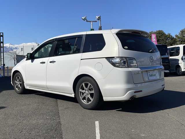 マツダ ＭＰＶ 23S 福島県 2012(平24)年 10.5万km クリスタルホワイトパールマイカ 社外メモリナビ＆フルセグＴＶ/（ＤＶＤ＆ＢＴ＆ＦＭ＆ＡＭ）/バックカメラ/衝突軽減ブレーキ/ＥＴＣ/社外１７inアルミホイール/オートライト/ＬＥＤライト/フォグランプ/電動格納ミラー/スマートキー/Ｗエアバッグ/横滑り防止装置/ＡＢＳ/純正ドアバイザー/純正フロアマット/新車保証書/取扱説明書/記録簿/純正ＡＷラジアルタイヤ４本積載/　（２１年製造、２１５／６０Ｒ１７）/オットマン/ウォークスルー/センターコンソール