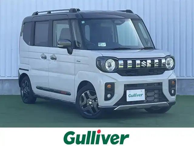 スズキ スペーシア ギア HYBRID XZ 香川県 2024(令6)年 0.3万km 黄Ⅱ ヘッドアップディスプレイ/両側パワースライドドア/シートヒーター/ステアリングヒーター/スズキセーフティサポート/→デュアルカメラブレーキサポート（衝突軽減）/→車線逸脱抑制機能/→アダプティブクルーズコントロール/→誤発進抑制機能/→標識認識機能/ルーフレール/ステアリングヒーター/ステアリングリモコン/LEDオートライト/LEDフォグランプ/電動格納ミラー（ウィンカー付）/12V電源/後席サンシェード/後席オットマン/スマートキー