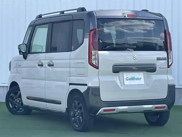 スズキ スペーシア ギア HYBRID XZ 香川県 2024(令6)年 0.3万km 黄Ⅱ ヘッドアップディスプレイ/両側パワースライドドア/シートヒーター/ステアリングヒーター/スズキセーフティサポート/→デュアルカメラブレーキサポート（衝突軽減）/→車線逸脱抑制機能/→アダプティブクルーズコントロール/→誤発進抑制機能/→標識認識機能/ルーフレール/ステアリングヒーター/ステアリングリモコン/LEDオートライト/LEDフォグランプ/電動格納ミラー（ウィンカー付）/12V電源/後席サンシェード/後席オットマン/スマートキー