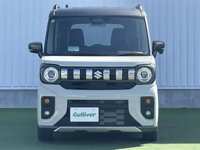 スズキ スペーシア ギア HYBRID XZ 香川県 2024(令6)年 0.3万km 黄Ⅱ ヘッドアップディスプレイ/両側パワースライドドア/シートヒーター/ステアリングヒーター/スズキセーフティサポート/→デュアルカメラブレーキサポート（衝突軽減）/→車線逸脱抑制機能/→アダプティブクルーズコントロール/→誤発進抑制機能/→標識認識機能/ルーフレール/ステアリングヒーター/ステアリングリモコン/LEDオートライト/LEDフォグランプ/電動格納ミラー（ウィンカー付）/12V電源/後席サンシェード/後席オットマン/スマートキー
