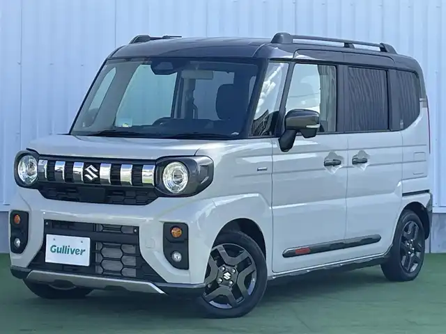 スズキ スペーシア ギア HYBRID XZ 香川県 2024(令6)年 0.3万km 黄Ⅱ ヘッドアップディスプレイ/両側パワースライドドア/シートヒーター/ステアリングヒーター/スズキセーフティサポート/→デュアルカメラブレーキサポート（衝突軽減）/→車線逸脱抑制機能/→アダプティブクルーズコントロール/→誤発進抑制機能/→標識認識機能/ルーフレール/ステアリングヒーター/ステアリングリモコン/LEDオートライト/LEDフォグランプ/電動格納ミラー（ウィンカー付）/12V電源/後席サンシェード/後席オットマン/スマートキー