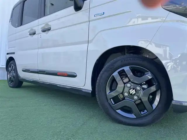 スズキ スペーシア ギア HYBRID XZ 香川県 2024(令6)年 0.3万km 黄Ⅱ ヘッドアップディスプレイ/両側パワースライドドア/シートヒーター/ステアリングヒーター/スズキセーフティサポート/→デュアルカメラブレーキサポート（衝突軽減）/→車線逸脱抑制機能/→アダプティブクルーズコントロール/→誤発進抑制機能/→標識認識機能/ルーフレール/ステアリングヒーター/ステアリングリモコン/LEDオートライト/LEDフォグランプ/電動格納ミラー（ウィンカー付）/12V電源/後席サンシェード/後席オットマン/スマートキー