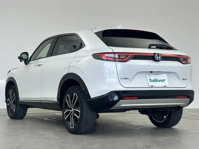 ホンダ ヴェゼル ハイブリッド e:HEV Z 大阪府 2021(令3)年 2.3万km プラチナホワイトパール 寒冷地仕様/純正8インチベーシックインターナビ/　　・CD/DVD/BT/フルセグ/USBポート/ETC/ステアリングリモコン/ハンドルヒーター/パドルシフト/ワイパーデアイサー/シートヒーター（運転席/助手席）/デュアルエアコン/レーダークルーズコントロール/電動パーキングブレーキ/ダウンヒルアシストコントロール/BSM/ハーフレザーシート/純正LEDヘッドライト/フォグランプ