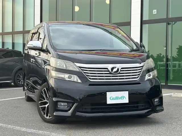 トヨタ ヴェルファイア 2．4Z プラチナセレⅡ ゴールド 和歌山県 2010(平22)年 13.4万km ブラック 純正7インチナビ/バックカメラ/ビルトインETC/前方ドライブレコーダー/両側パワースライド/前後コーナーセンサー/オットマン/オートライト/ツイーター（パイオニア）/電動リアゲート/フルオートパワーウィンドウ/ステアリングリモコン/オートワイパー/ドアバイザー/HIDヘッドライト/プッシュスタート