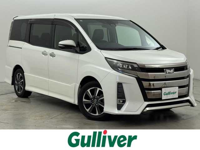 トヨタ ノア Si ダブルバイビー 福岡県 2018(平30)年 7.5万km ホワイトパールクリスタルシャイン ワンオーナー　/純正９型ナビ（フルセグＴＶ）　/バックカメラ　/ビルトインＥＴＣ　/クルーズコントロール　/衝突軽減ブレーキ　/レーンキープ　/先行車発進　/オートマチックハイビーム　/ＭＴモード付き　/両側電動スライドドア　/ハーフレザー　/ＬＥＤヘッドライト　/純正１６インチアルミホイール