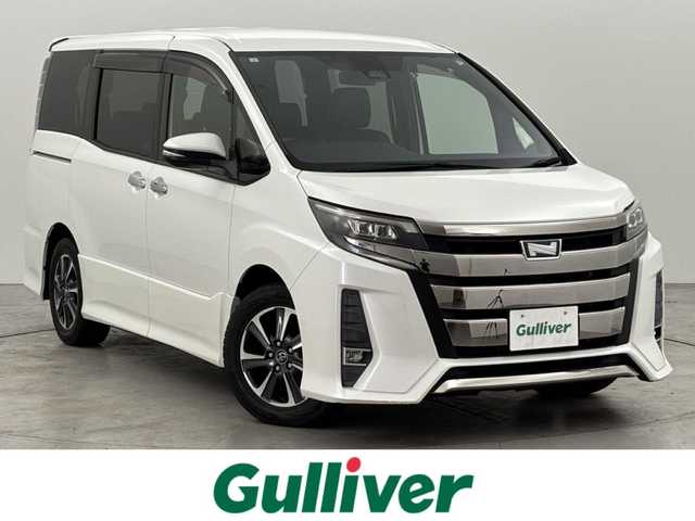 トヨタ ノア Si ダブルバイビー 福岡県 2018(平30)年 7.5万km ホワイトパールクリスタルシャイン ワンオーナー　/純正９型ナビ（フルセグＴＶ）　/バックカメラ　/ビルトインＥＴＣ　/クルーズコントロール　/衝突軽減ブレーキ　/レーンキープ　/先行車発進　/オートマチックハイビーム　/ＭＴモード付き　/両側電動スライドドア　/ハーフレザー　/ＬＥＤヘッドライト　/純正１６インチアルミホイール
