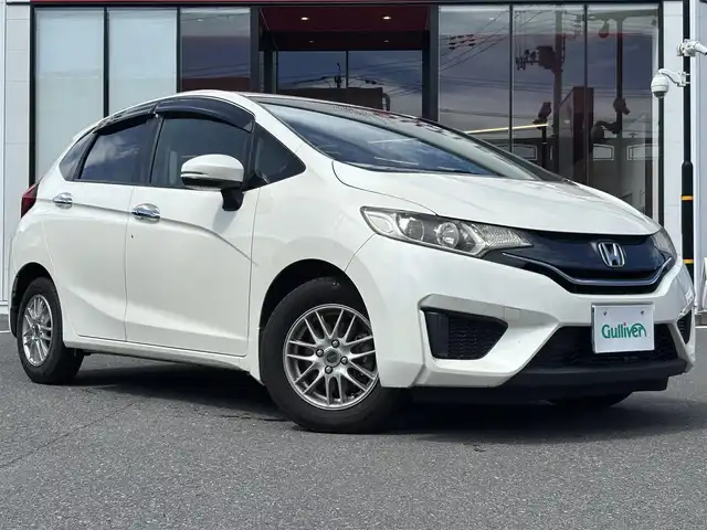 ホンダ フィット 13G Lパッケージ 宮城県 2013(平25)年 10.9万km プレミアムホワイトパール 登録時走行距離108880km/FM・AM・ワンセグTV・CD・DVD・社外ナビ/スペアキーあり/ETC/スマートキー/スターター/アイドリングストップ/プッシュスタート/ウインカーミラー/電動格納ミラー/ドアバイザー/純正フロアマット/社外アルミホイール/カーテンエアバッグ/ECONモード