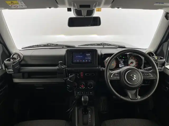 スズキ ジムニー XC 富山県 2023(令5)年 2.1万km ブルーイッシュブラックパール3 社外ディスプレイオーディオ（AM/FM/BT）/バックカメラ/ETC/シートヒーター/衝突被害軽減システム/クルーズコントロール/レーンキープアシスト/横滑り防止装置/アイドリングストップ/純正アルミホイール/社外フロアマット/オートLEDライト/フォグライト/革巻きステアリング/ステアリングスイッチ/スマートキー/スペアキー