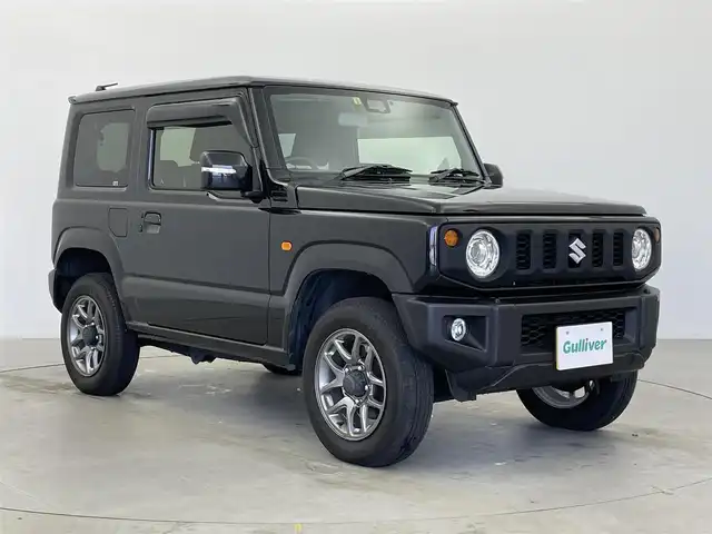 スズキ ジムニー XC 富山県 2023(令5)年 2.1万km ブルーイッシュブラックパール3 社外ディスプレイオーディオ（AM/FM/BT）/バックカメラ/ETC/シートヒーター/衝突被害軽減システム/クルーズコントロール/レーンキープアシスト/横滑り防止装置/アイドリングストップ/純正アルミホイール/社外フロアマット/オートLEDライト/フォグライト/革巻きステアリング/ステアリングスイッチ/スマートキー/スペアキー