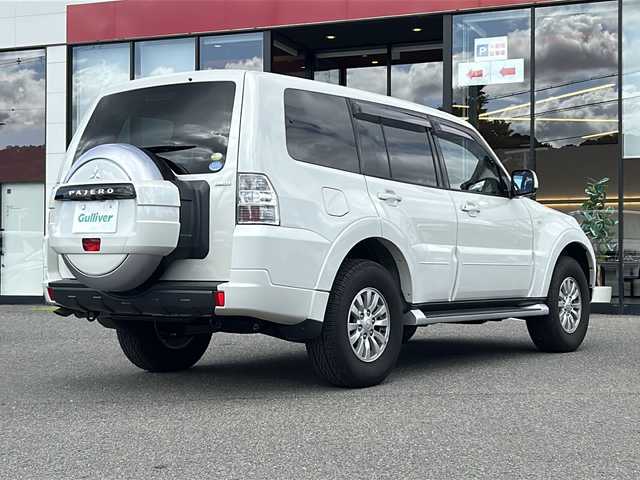 三菱 パジェロ ロング GR 大阪府 2010(平22)年 0.8万km ウォームホワイトパール ワンオーナー/社外ナビ/フルセグTV・CD/DVD/ETC/背面ハードカバー/後席モニター/３列シート/フォグランプ/電格ミラー/純正１６インチAW/リモコンキー/取説/保証書/スペアキーｘ１
