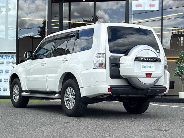 三菱 パジェロ ロング GR 大阪府 2010(平22)年 0.8万km ウォームホワイトパール ワンオーナー/社外ナビ/フルセグTV・CD/DVD/ETC/背面ハードカバー/後席モニター/３列シート/フォグランプ/電格ミラー/純正１６インチAW/リモコンキー/取説/保証書/スペアキーｘ１
