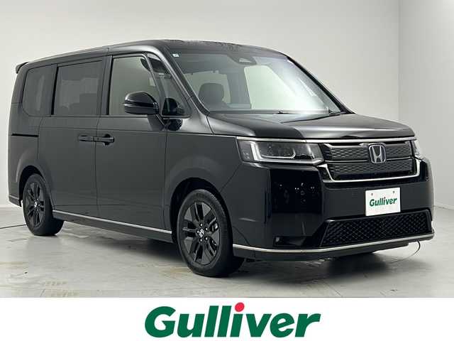 ホンダ ステップワゴン スパーダ eHEV 茨城県 2025(令7)年 0.1千km クリスタルブラックパール 登録済未使用車/11.4インチナビHondaコネクトナビ［LXM-247VFLi］/・Bluetooth/CD/DVD/フルセグTV/パワーテールゲート/バックカメラ/両側電動スライドドア/Honda SENSING/・衝突軽減ブレーキ/・先行車発進お知らせ機能/・歩行者事故軽減ステアリング/・路外逸脱抑制機能/・標識認識機能/・渋滞追従機能付アダプティブクルーズコントロール/・車線維持支援システム/・トラフィックジャムアシスト/・ブラインドスポットインフォメーション/・誤発進抑制機能/・オートハイビーム/・アダプティブドライビングビーム/2列目オットマン/2列目テーブル/全列USBチャージャー/純正16インチAW