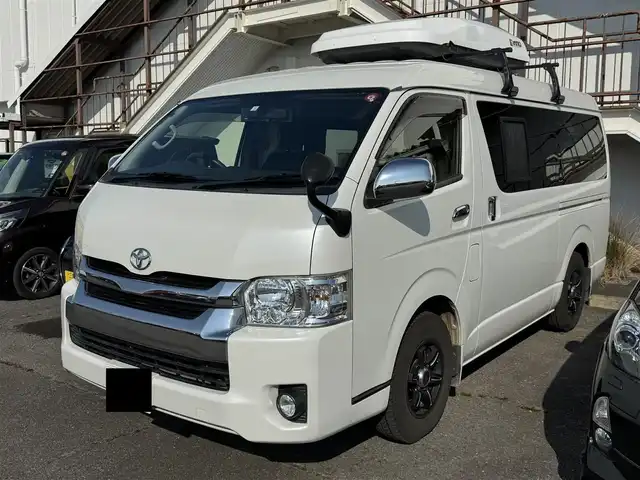 トヨタ ハイエース GL ロング 三重県 2014(平26)年 19.5万km ホワイトパールクリスタルシャイン 電子レンジ/就寝設備/片側イージークローザードア/カロッツェリア 7インチナビ AVIC-MRZ099/バックカメラ/プッシュスタート/LEDヘッドライト/オートライト/オートエアコン/社外15inAW/革調シートカバー/スタッドレスタイヤ