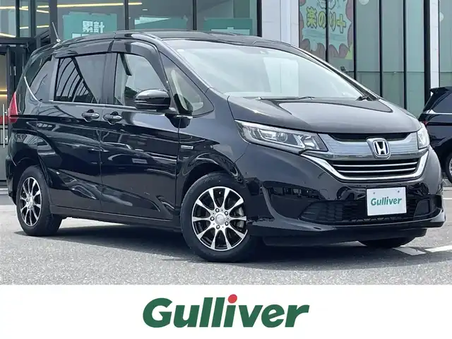 ホンダ フリード ハイブリット G ホンダセンシング 島根県 2018(平30)年 5.7万km プレミアムスパークルブラックパール 社外ナビ/CD/DVD/DTV/Bluetooth/バックカメラ/レーダークルーズコントロール/両側パワースライドドア/ステアリングスイッチ/LEDオートライト/ビルトインETC/レーンキープ/フロントワイパーデアイサー /スマートキー/スペアキー /プッシュスタート /フロアマット/ドアバイザー/革調シートカバー
