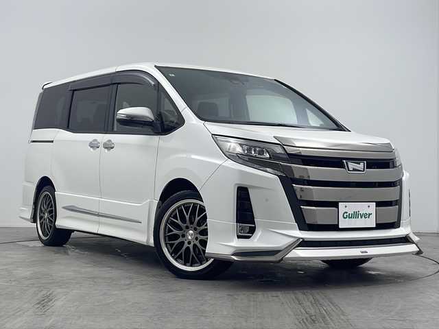 トヨタ ノア Si ダブルバイビーⅡ 大阪府 2020(令2)年 3.1万km ホワイトパールクリスタルシャイン 禁煙車/純正１０インチナビ/・Bluetooth・フルセグ・CD/DVD・SD・AM/FM/両側パワースライドドア/純正１２．１インチフリップダウン/トヨタセーフティセンス/・プリクラッシュセーフティシステム・LDA・PKSB/・クリアランスソナー・先行車発進お知らせ機能/前後コーナーセンサー/前後ドラレコ/モデリスタエアロ/Ｂカメラ/クルーズコントロール/MTモード付ATシフト/AUTOライト/オートマチックハイビーム/ビルドインETC2.0/ハーフレザーシート/LEDヘッドライト