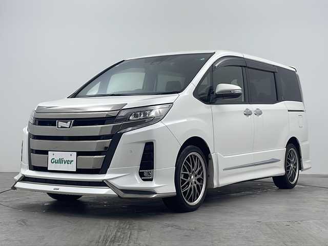 トヨタ ノア Si ダブルバイビーⅡ 大阪府 2020(令2)年 3.1万km ホワイトパールクリスタルシャイン 禁煙車/純正１０インチナビ/・Bluetooth・フルセグ・CD/DVD・SD・AM/FM/両側パワースライドドア/純正１２．１インチフリップダウン/トヨタセーフティセンス/・プリクラッシュセーフティシステム・LDA・PKSB/・クリアランスソナー・先行車発進お知らせ機能/前後コーナーセンサー/前後ドラレコ/モデリスタエアロ/Ｂカメラ/クルーズコントロール/MTモード付ATシフト/AUTOライト/オートマチックハイビーム/ビルドインETC2.0/ハーフレザーシート/LEDヘッドライト