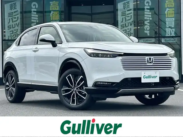 ホンダ ヴェゼル ハイブリッド e:HEV Z 岡山県 2025(令7)年 0.1千km プラチナホワイトパール 登録時走行距離3km/登録済未使用車/純正9インチナビ/フルセグTV(AM.FM.TV.BT)/バックカメラ/ビルトインETC2.0/ブラインドスポットモニター/シートヒーター/ステアリングヒーター/クリアランスソナー/衝突軽減ブレーキ/レーダークルーズコントロール/レーンキープアシスト/ダウンヒルアシストコントロール/横滑り防止装置/オートライト/アイドリングストップ/パワーバックドア/ワイヤレス充電/18インチ純正AW