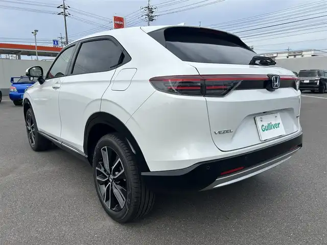 ホンダ ヴェゼル ハイブリッド e:HEV Z 岡山県 2025(令7)年 0.1千km プラチナホワイトパール 登録時走行距離3km/登録済未使用車/純正9インチナビ/フルセグTV(AM.FM.TV.BT)/バックカメラ/ビルトインETC2.0/ブラインドスポットモニター/シートヒーター/ステアリングヒーター/クリアランスソナー/衝突軽減ブレーキ/レーダークルーズコントロール/レーンキープアシスト/ダウンヒルアシストコントロール/横滑り防止装置/オートライト/アイドリングストップ/パワーバックドア/ワイヤレス充電/18インチ純正AW