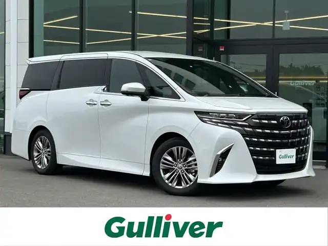 トヨタ アルファードハイブリット Z 東京都 2024(令6)年 1.2万km プラチナホワイトパールマイカ 純正ディスプレイオーディオ/フリップダウンモニター/左右独立ムーンルーフ/アドバンストパーク/デジタルインナーミラー/スペアタイヤ/両側パワースライドドア/パワーバックドア/ビルトインETC/AC100V/シートヒーター/ベンチレーションシート/トヨタセーフティセンス/プリクラッシュセーフティ/レーントレーシングアシスト/レーダークルーズコントロール/オートマチックハイビーム/ブラインドスポットモニター/ドライブレコーダー