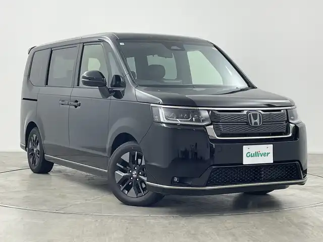 ホンダ ステップワゴン スパーダ eHEV 群馬県 2025(令7)年 0.1千km クリスタルブラックパール 登録済未使用車　純正１１．４型ナビ　バックカメラ　前席シートヒーター　アダプティブクルーズコントロール　パドルシフト　電動リアドゲート　両側電動スライドドア　衝突被害軽減ブレーキ　ＢＳＭ　ＬＥＤ　禁煙