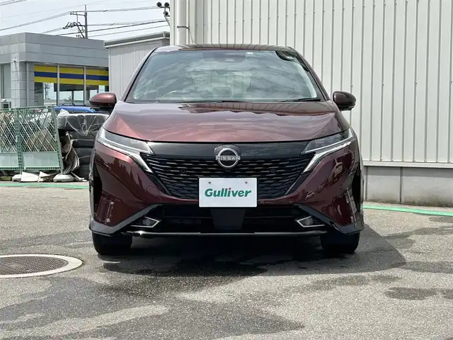 日産 オーラ G FOUR レザーエディション 富山県 2022(令4)年 2.8万km バーガンディー 〇ワンオーナー/〇純正9インチナビ/〇フルセグTV/〇バックカメラ/〇アラウンドビューモニター/〇インテリジェントルームミラー/〇ビルトインETC2.0/〇BOSEサウンドシステム/〇全方位運転支援システム/〇インテリジェントエマージェンシーブレーキ/〇プロパイロット/〇LEDヘッドランプ/〇オートライト/〇フォグランプ/〇純正17インチアルミ/〇革巻きステアリング/〇ステアリングヒーター/〇オートエアコン/〇革シート/〇シートヒーター/〇インテリジェントキー/〇禁煙車