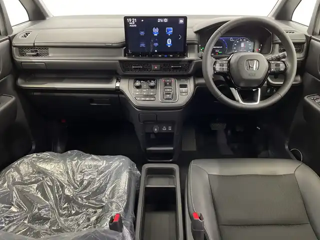 ホンダ ステップワゴン スパーダ eHEV 栃木県 2025(令7)年 0.1千km クリスタルブラックパール 登録済未使用車/純正11.4インチナビ/　(CD/DVD/Bluetooth/USB/フルセグTV)/バックカメラ/全方位カメラ/ホンダセンシング/・衝突軽減ブレーキ（CMBS）/・先行車発進お知らせ機能/・歩行者事故低減ステアリング/・路外逸脱抑制機能/・標識認識機能/・渋滞追従機能付アダプティブクルーズコントロール（ACC）/・車線維持支援システム（LKAS）/・トラフィックジャムアシスト（渋滞運転支援機能）/・ブラインドスポットインフォメーション/・誤発進抑制機能/・後方誤発進抑制機能/・近距離衝突軽減ブレーキ/・急アクセル抑制機能/・パーキングセンサーシステム/・オートハイビーム/両側パワースライドドア/電動リアゲート/2列目オットマン/ハーフレザーシート/前席シートヒーター/全列USBチャージャー/純正16インチAW/LEDヘッドライト