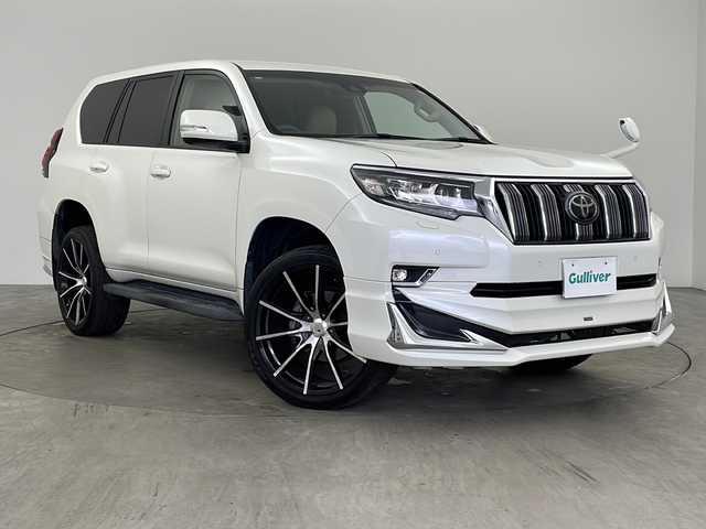 トヨタ ランドクルーザー プラド TX 兵庫県 2018(平30)年 6万km ホワイトパールクリスタルシャイン ・純正9インチナビ/CD/DVD/TV/SD/Bluetooth/・バックカメラ/・ビルトインETC/・Toyota　Safety　Sense/・レーンディパチャーアラート/・プリクラッシュセーフティ/・レーダークルーズコントロール/・オートマチックハイビーム/・クリアランスソナー/・モデリスタエアロ/・ＬＥＤヘッドライト/・オートライト/・クリアランスソナー/・社外22インチアルミホイール/・社外革調シートカバー/・ヘッドライトウォッシャー/・純正17インチホイールあり/・社外マフラー