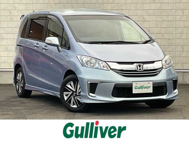 ホンダ フリード ハイブリット ジャストセレクション 群馬県 2015(平27)年 7.9万km プレミアムブルーオパールメタリック ６人乗り　/ナビ　/フルセグ・ＣＤ・ＤＶＤ再生　/バックカメラ　/両側パワースライドドア　/クルーズコントロール　/ドライブレコーダー　/リアスポイラー　/無限フロアマット　/ＥＴＣ　/横滑り防止装置　/ＬＥＤオートライト