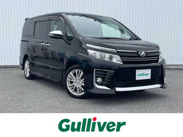 トヨタ ヴォクシー ZS 煌 滋賀県 2016(平28)年 3.8万km ブラック 純正10型SDナビ/(フルセグTV・CD DVD・Bluetooth)/フリップダウンモニター/バックカメラ/衝突軽減ブレーキ/車線逸脱警報/両側パワースライドドア/ETC/プッシュスタート/スマートキー/ステアリングリモコン/アイドリングストップ/ステアリングリモコン/純正フロアマット/LEDヘッドライト/フォグライト