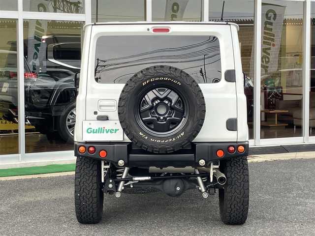 スズキ ジムニー XC 山口県 2021(令3)年 1.5万km ピュアホワイトP ワンオーナー/APIO静香御前マフラー/TANIGUCHI SOLVE AC60サス/　6cmリフトアップキット取り付け/APIOタクティカルリアバンパー/KLCヘリテージトラディショナルFバンパー/10インチメモリーナビ・フルセグTV/バックカメラ/前後ドライブレコーダー/スマートキー/フロントシートヒーター/クルーズコントロール/レーンアシスト/衝突被害軽減システム/LEDオートライト/フォグランプ