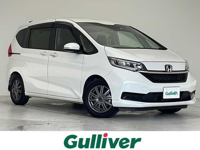 ホンダ フリード＋ ハイブリット G 愛知県 2022(令4)年 2.5万km プラチナホワイトパール 衝突軽減システム/純正9型ナビ/フリップダウンモニター/両側パワースライドドア/クルーズコントロール/シートヒーター/フルセグ/CD DVD/Bluetooth/バックカメラ/コーナーセンサー/アルミホイール/LEDヘッドライト/オートライト/ドライブレコーダー/ETC/ステアリングスイッチ/スマートキー/プッシュスタート
