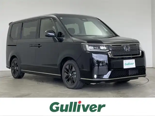 ホンダ ステップワゴン スパーダ eHEV 埼玉県 2025(令7)年 0.1千km クリスタルブラックパール 登録済未使用車/ホンダセンシング/衝突軽減ブレー/路外逸脱抑制機能/渋滞追従機能付アダプティブクルーズコントロール/車線維持支援システム/トラフィックジャムアシスト（渋滞運転支援機能）/純正11.4インチナビ/　DTV CD DVD BT USB SD SDREC/両側パワースライドドア/ハーフレザーシート/バックカメラ/パドルシフト/電動リアゲート/ウォークスルー/TRC（トラクションコントロール）/エンジンスタートボタン/スマートキー/スペアキー/LEDオートライト
