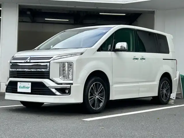 三菱 デリカＤ：５ アーバンギア G パワーパッケージ 京都府 2019(令1)年 5.6万km ウォームホワイトパール 社外ＳＤナビ　フリップダウンモニター　全周囲カメラ　ＥＴＣ　シートヒーター　クルーズコントロール（追従機能付き）　レーンキープアシスト　衝突軽減ブレーキ　左側電動ステップ　パワーバックドア　ＬＥＤライト