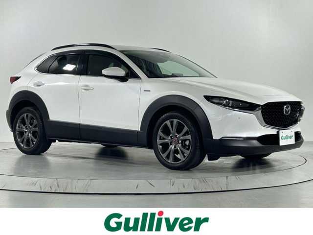 マツダ ＣＸ－３０ 佐賀県 2020(令2)年 8.7万km スノーフレイクホワイトパールマイカ 純正１０．２５インチナビ/（フルセグTV/CD/DVD/Bluetooth/USB/HDMI）/衝突被害軽減システム/ＢＯＺＥプレミアムサウンド/全方位カメラ/前後ドライブレコーダー/追従型クルーズコントロール/運転席パワーシート/レザーシート/シートヒーター/コーナーセンサー/ハンドルヒーター/ヘッドアップディスプレイ/パワーバックドア/シートポジションメモリ/レーダー/横滑り防止装置/盗難防止装置