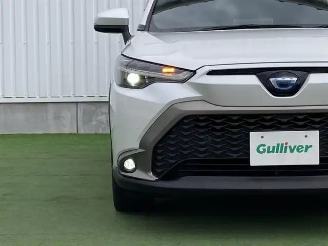 トヨタ カローラ クロス ハイブリッド Z 香川県 2023(令5)年 3.3万km プラチナホワイトパールマイカ トヨタセーフティーセンス/・プリクラッシュ/・ＬＴＡ/純正9インチナビ/バックカメラ/ハーフレザーシート/シートヒーター/パワーシート/パワーバックドア/革巻きステアリング/ステアリングリモコン/レーダークルーズ/ＢＳＭ/ＬＥＤライト/ＡＣ１００Ｖ/スマートキー