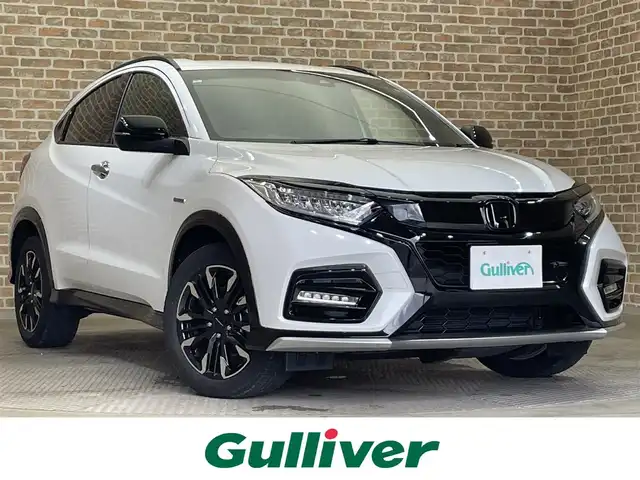 ホンダ ヴェゼル ハイブリッド モデューロ X ホンダセンシング 岩手県 2021(令3)年 3.3万km プラチナホワイトパール ワンオーナー/４WD/専用グリル・エアロバンパー/専用サスペンション/専用スポーティシート/ホンダセンシング/衝突軽減ブレーキ/路外逸脱抑制機能/アダプティブクルーズコントロール/車線維持支援機能/標識認識機能/先行車発信お知らせ機能/誤発進抑制機能/横滑り防止装置/シートヒーター/ワイパーデアイサー/純正ナビ/フルセグTV/ステアリングスイッチ/バックカメラ/ドライブレコーダー/ETC/LEDヘッドライト/LEDフォグライト/純正１７インチアルミホイール