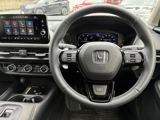 ホンダ ＺＲ－Ｖ ハイブリッド e:HEV Z 熊本県 2024(令6)年 1.3万km プラチナホワイトパール BOSEサウンド/純正ナビ/【フルセグTV/Bluetooth/USB/ラジオ】/全方位カメラ/レーダークルーズコントロール/パドルシフト/衝突軽減ブレーキ/レーンキープアシスト/先行車発進お知らせ機能/パーキングセンサー/ダウンヒルアシスト/標識認識機能/黒革シート/前席パワーシート/運転席シートメモリ/前席シートヒーター/ビルトインETC2.0/前後ドライブレコーダー（DRH-224SD）/横滑り防止機能/ブレーキホールド/純正18インチAW/ワイヤレス充電/ステアリングヒーター/革巻きステアリング/ステアリングスイッチ/オートライト/LEDヘッドライト/純正フロアマット/ドアバイザー/保証書/取扱説明書