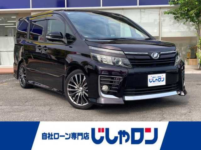 トヨタ ヴォクシー ZS 静岡県 2014(平26)年 13.4万km ボルドーマイカメタリック (株)IDOMが運営する【じしゃロン焼津店】の自社ローン専用車両になります。こちらは現金またはオートローンご利用時の価格です。自社ローンご希望の方は別途その旨お申付け下さい /社外ＳＤナビ/(フルセグＴＶ/Ｂｌｕｅｔｏｏｔｈ接続/ＣＤ/ＤＶＤ)/後席モニター/片側パワースライドドア/バックカメラ/ＥＴＣ/プッシュスタート＆スマートキー/ＬＥＤヘッドライト/オートライト