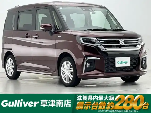 スズキ ソリオ HV MZ 滋賀県 2024(令6)年 1万km メロウディープレッドパール 社外8インチナビ/【CD.DVD.Bluetooth.フルセグTV】/全方位カメラ/衝突軽減ブレーキ/追従クルーズコントロール/レーンキープアシスト/LEDヘッドライト/オートライト/オートハイビーム/前席シートヒーター/ETC/前方ドライブレコーダー/クリアランスソナー/アイドリングストップ/両側電動スライドドア/ヘッドアップディスプレイ/プッシュスタート/スマートキー