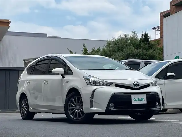 トヨタ プリウス α S 東京都 2017(平29)年 6.9万km スーパーホワイトⅡ 社外メモリーナビ/　BT AM/FM AUX/３列シート/シルバー加飾ウレタン製ステアリングホイール/　ステアリングスイッチ/（マルチインフォメーション/オーディオ）/革巻きアームレスト付センターコンソール/ETC/ドライブレコーダー（前方）/レベライザー/デジタルメーター/スマートエントリー/レベライザー/プッシュスタート/AW付サマータイヤ車載/保証書＆取扱説明書
