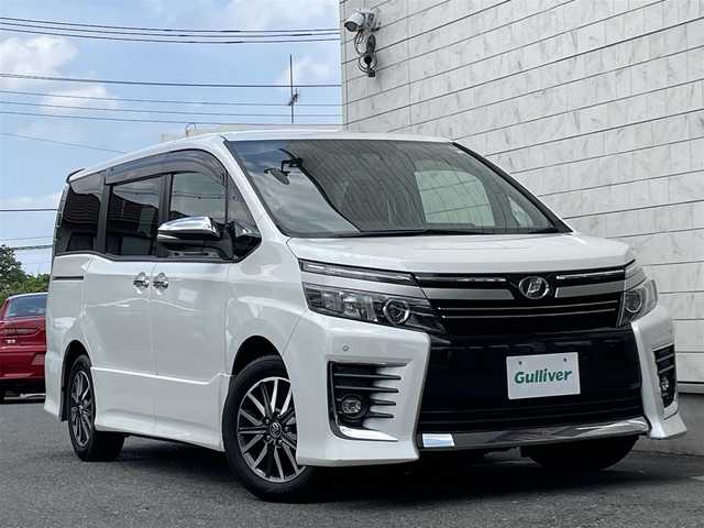 トヨタ ヴォクシー ZS 煌Ⅱ 埼玉県 2016(平28)年 7.7万km ホワイトパールクリスタルシャイン レーダーブレーキサポート/レーンキープ/オートハイビーム/純正10インチナビゲーション/純正後席フリップダウンモニター/CD/DVD/Bluetooth/フルセグTV/バックカメラ/7人乗り/両側電動スライドドア/FRコーナーセンサー/LEDヘッドライト/アイドリングストップ/スマートキー/スペアキー/ETC