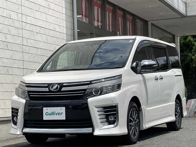 トヨタ ヴォクシー ZS 煌Ⅱ 埼玉県 2016(平28)年 7.7万km ホワイトパールクリスタルシャイン レーダーブレーキサポート/レーンキープ/オートハイビーム/純正10インチナビゲーション/純正後席フリップダウンモニター/CD/DVD/Bluetooth/フルセグTV/バックカメラ/7人乗り/両側電動スライドドア/FRコーナーセンサー/LEDヘッドライト/アイドリングストップ/スマートキー/スペアキー/ETC