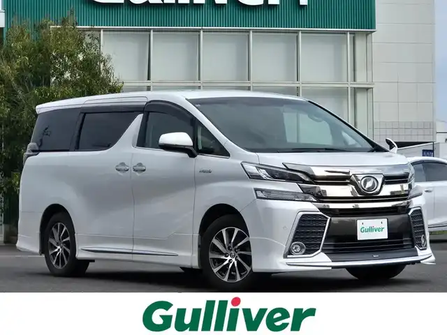 トヨタ ヴェルファイア ハイブリット ZR 鹿児島県 2016(平28)年 8.2万km ホワイトパールクリスタルシャイン モデリスタエアロ/後席フリップダウンモニター　/ビルトインＥＴＣ　/両側パワースライドドア　/レーダークルーズコントロール　/パワーバックドア　/純正ＳＤナビ（ＮＳＺＮ－Ｚ６６Ｔ）　/Ｂｌｕｅｔｏｏｔｈオーディオ　/フルセグテレビ/D+N席パワーシート/オットマン/バックカメラ/純正アルミホイール(17インチ)/前後コーナーセンサー/横滑り防止装置/エアバッグ(W+サイド)/カーテンエアバッグ/プッシュスタート/スマートキー