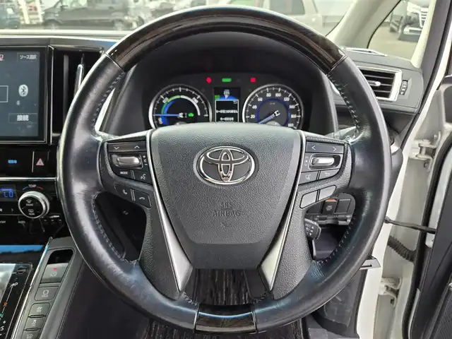 トヨタ ヴェルファイア ハイブリット ZR 鹿児島県 2016(平28)年 8.2万km ホワイトパールクリスタルシャイン モデリスタエアロ/後席フリップダウンモニター　/ビルトインＥＴＣ　/両側パワースライドドア　/レーダークルーズコントロール　/パワーバックドア　/純正ＳＤナビ（ＮＳＺＮ－Ｚ６６Ｔ）　/Ｂｌｕｅｔｏｏｔｈオーディオ　/フルセグテレビ/D+N席パワーシート/オットマン/バックカメラ/純正アルミホイール(17インチ)/前後コーナーセンサー/横滑り防止装置/エアバッグ(W+サイド)/カーテンエアバッグ/プッシュスタート/スマートキー