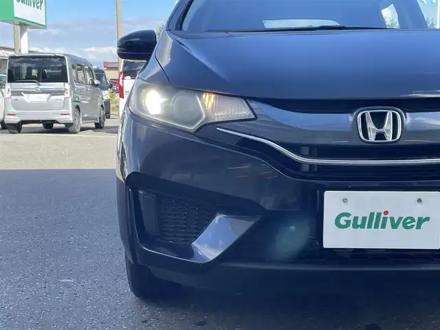ホンダ フィット 13G Lパッケージ 青森県 2013(平25)年 5.4万km クリスタルブラックパール ４WD/社外オーディオ（CD/AM/FM）/スマートキー/横滑り防止/アイドリングストップ/衝突被害軽減システム/純正フロアマット/アクセサリーソケット