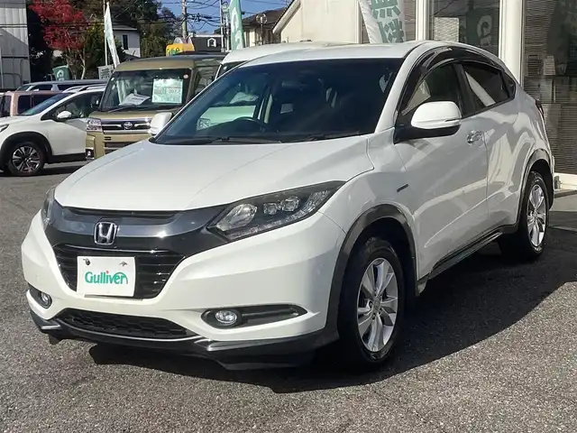 ホンダ ヴェゼル ハイブリッド X 千葉県 2015(平27)年 11.1万km ホワイトオーキッドパール ワンオーナー 車/純正ナビゲーション/Bluetooth/CD/TV/バックカメラ/スマートキー×2/LEDヘッドライト/横滑り防止装置/取り扱い説明書有り/ドライブレコーダー/ETC