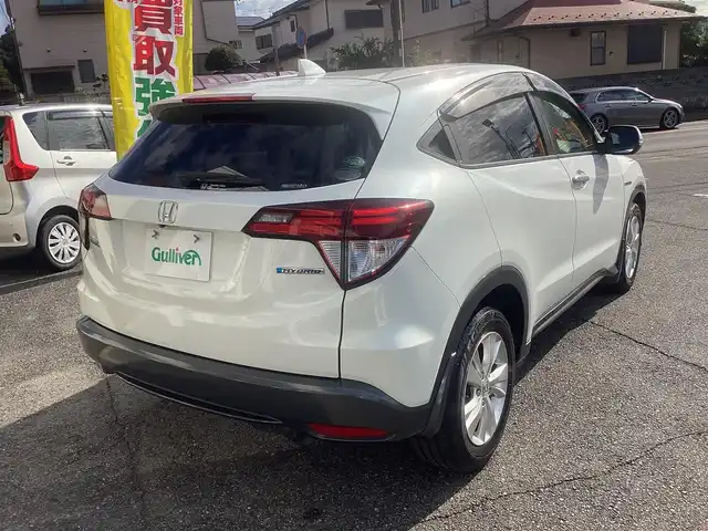 ホンダ ヴェゼル ハイブリッド X 千葉県 2015(平27)年 11.1万km ホワイトオーキッドパール ワンオーナー 車/純正ナビゲーション/Bluetooth/CD/TV/バックカメラ/スマートキー×2/LEDヘッドライト/横滑り防止装置/取り扱い説明書有り/ドライブレコーダー/ETC