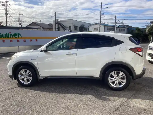 ホンダ ヴェゼル ハイブリッド X 千葉県 2015(平27)年 11.1万km ホワイトオーキッドパール ワンオーナー 車/純正ナビゲーション/Bluetooth/CD/TV/バックカメラ/スマートキー×2/LEDヘッドライト/横滑り防止装置/取り扱い説明書有り/ドライブレコーダー/ETC